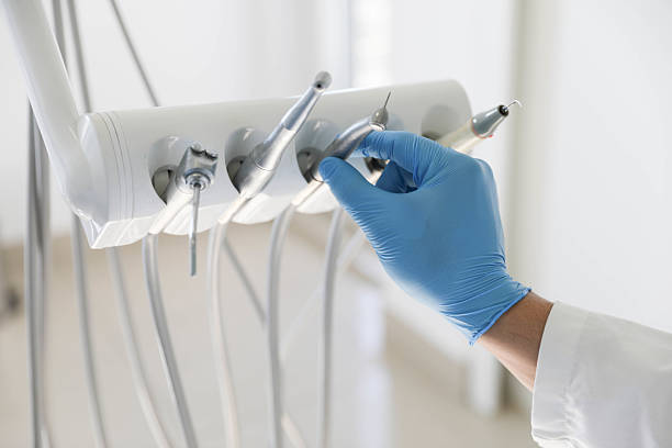Professional Emergency Dentist technician working in Gang Mills, NY